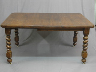 A Victorian oak extending dining table with 1 extra leaf, raised on spiral turned supports 58"