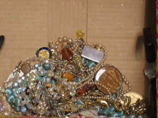 A Lifeboat badge and a collection of costume jewellery