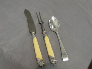 A Victorian silver carving knife and fork with ivory and silver mounted handles together with a Georgian silver Old English pattern table spoon