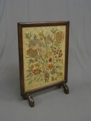A 1930's walnut fire screen with floral tapestry panel 25"