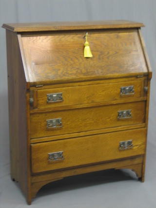 An Art Nouveau honey oak student's bureau with fall front above 3 long drawers 33"
