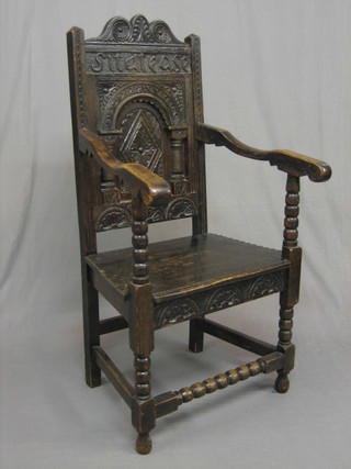 A Victorian carved oak Wainscot chair with solid seat, raised on turned and block supports