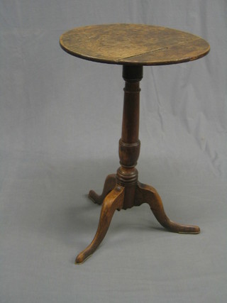 A 19th Century circular Country oak and elm wine table, raised on pillar and tripod supports 18" (crack to top and old wood worm evidence to column)