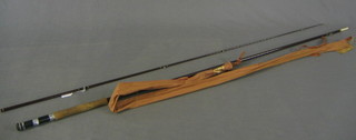 A carbon fibre 3 section fishing rod 10', Portman, hand built by East Anglian Rod Co. complete with fibre carrying case