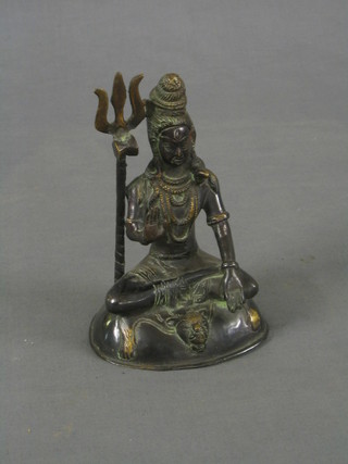 A 20th Century Eastern bronze figure of a seated Deity 7"