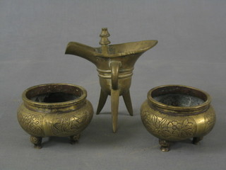 An 18th/19th Century bronze pouring vessel and 2 circular bronze Eastern dishes, base with seal marks