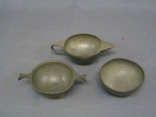 An Art Nouveau planished pewter cream jug and sugar bowl,  bases marked JHG and  a quaishe marked Tudor (3)