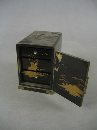 A miniature Eastern black lacquered cabinet, the interior fitted 3 drawers enclosed by a panelled door 4 1/2"
