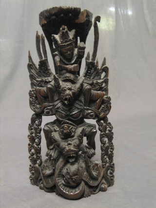 An Eastern carved wooden figure of a Deity 13"