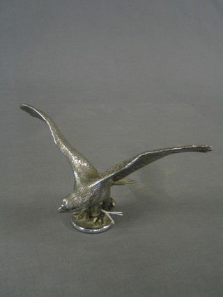 A 1930's chrome car mascot in the form an eagle with wings outstretched, the base marked F240, 12"