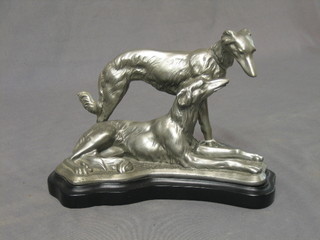 An Art Deco silvered resin figure group of 2 Afghan hounds 10"