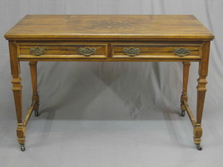 A Victorian walnut side table, fitted 2 drawers, raised on square tapering supports 48" (formerly a dressing table)