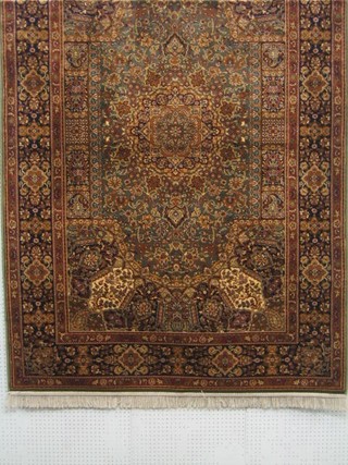 A green ground Persian design Belgian carpet 90" x 59"