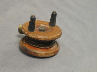 A brass and mahogany centre pin fishing reel 2 1/2"