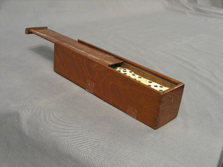 An  ebony and ivory domino 9 set, contained in a mahogany case