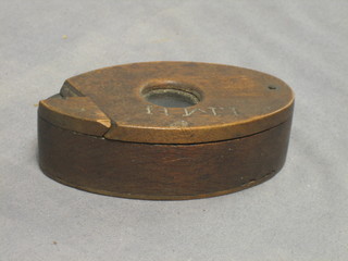 An oval wooden tobacco box with hinged lid 5"