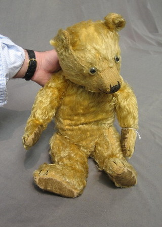 A yellow teddybear with articulated limbs 20"