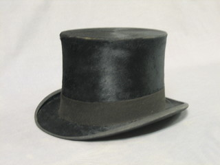 A gentleman's black silk top hat by Dunns, approx size 7