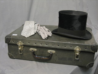 A gentleman's black silk top hat by A J White of Jermyn St., approx size 7, together with a pair of grey gloves contained in a Moss Bross hire case