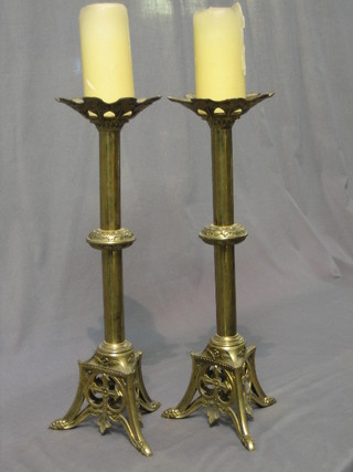 A pair of brass candlesticks 20"