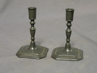 A pair of 18th Century candlesticks raised on square bases 6 1/2"