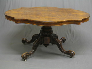 A 19th Century oval walnut Loo table, raised on a turned column and tripod base 56"