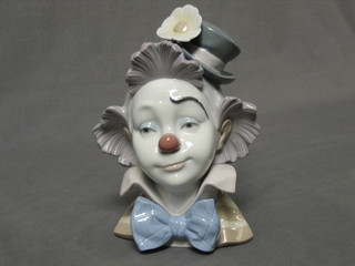 A Lladro head and shoulders portrait bust of a clown, base marked 5610 Cabeza Payasito Sombrilla Copa 