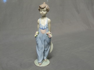 A Lladro figure of a walking boy gardener, base with 1997 Collector's Society mark and 7650 10"