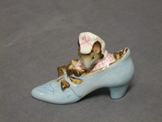 A Beswick Beatrix Potter figure, The Old Woman Who Lived in a Shoe, base marked 1959