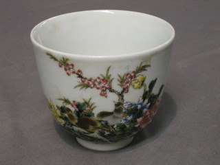 An Oriental circular porcelain bowl decorated birds amidst branches and with scrip to side, base with 6 character mark 4"