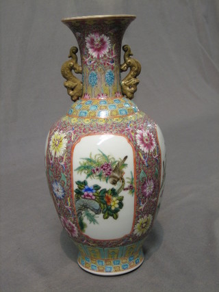 A Canton famille rose club shaped vase with applied dragon decoration, seal mark to base