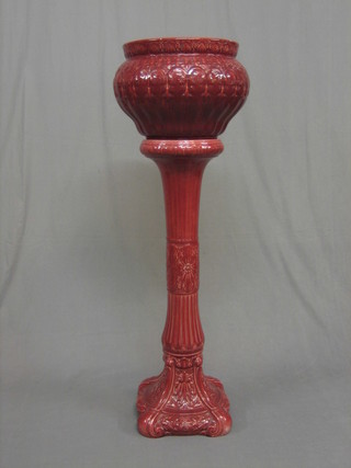 A red glazed jardiniere and stand 13" (jardiniere f and r)