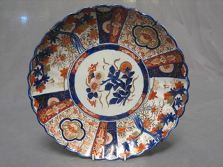 A 19th Century Japanese Imari porcelain plate, decorated flowers and with lobed border 11"