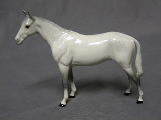 A Beswick figure of a standing dapple horse 8"