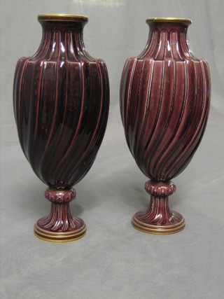 A pair of 19th Century Sevres red glazed porcelain club shaped vases, the bases marked S92 Sevres and with cypher mark, 11" (1 f and r)