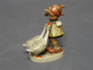 A Goebal figure of a standing girl with 2 geese, base marked 47/0 5" (slight chip to one tail)