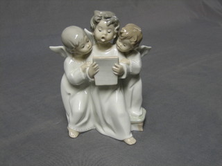 A Lladro figure group of 3 singing angels, base marked Lladro 6 1/2"