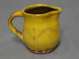 An Art Pottery jug, the handle with signature mark, brown glazed 4"