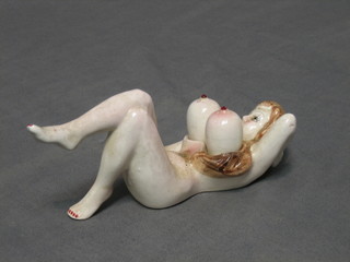 A tourist pottery condiment set in the form of a reclining naked lady 7"