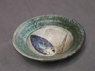 A circular green glazed Art Pottery bowl, the base marked Syex Damm 7 1/2"