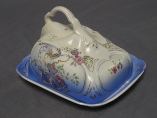 A blue and floral pattern cheese dish and cover 7"