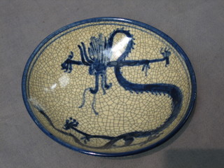 An Oriental circular crackle glazed bowl decorated dragon 6"