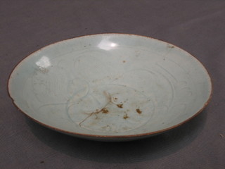 An Oriental Sung circular bowl with sculptured leaf design, slight chip to rim, 6"