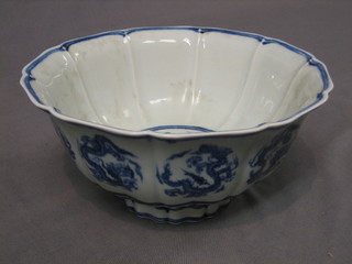 An Oriental circular blue and white porcelain bowl with lobed border, 6 character mark to base 8"