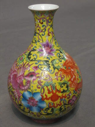 An Oriental club shaped vase decorated a dragon and phoenix, base with seal mark 6"