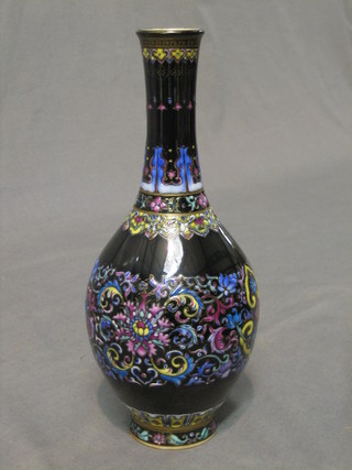 An Oriental black floral patterned club shaped vase, the base with seal mark 9"