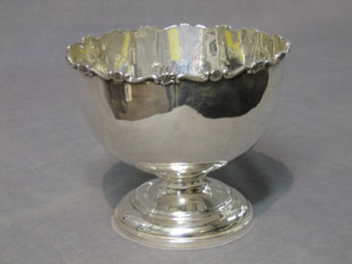 A Victorian circular silver pedestal rose bowl with wavy border, London 1922, 3 ozs (thin in places)