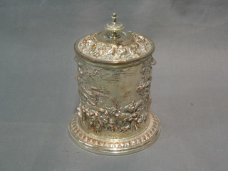 A 19th Century embossed circular silver plated tobacco jar and cover decorated feasting scenes, 5"