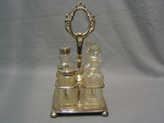 A silver plated 4 bottle cruet with 4 cut glass bottles