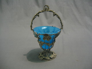 A Continental silver plated metal bon bon dish with pierced vinery decoration and blue glass liner
